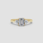 Load and play video in Gallery viewer, IGI Certified Lab-Grown Emerald-Cut and Trillion Diamond Three Stone Reverse Tapered Shank Engagement Ring
